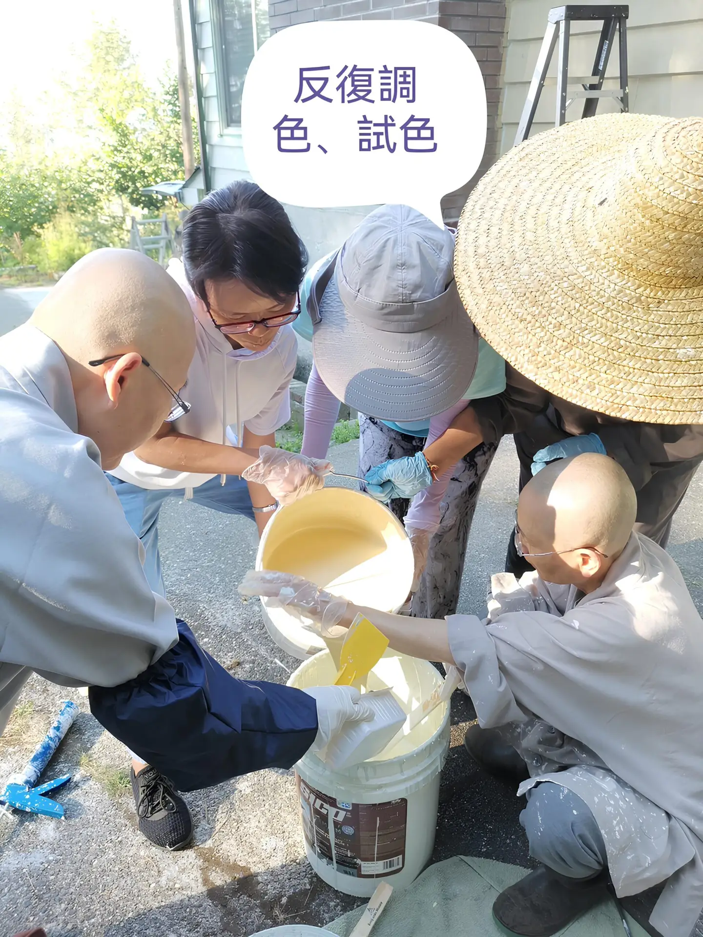 Sangha members and volunteers experimenting with colors before painting